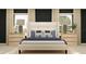 Serene bedroom with a plush bed, stylish lamps, and coordinating nightstands at 36017 Joseph Blake St, Zephyrhills, FL 33541