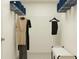 Organized walk-in closet featuring shelving and clothing racks to maximize storage space at 36017 Joseph Blake St, Zephyrhills, FL 33541