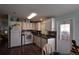 Functional kitchen featuring a stove, microwave, and tile backsplash at 37643 Campo Ave, Zephyrhills, FL 33541