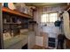 Utility room with shelving, washer, dryer, and lots of extra storage at 37643 Campo Ave, Zephyrhills, FL 33541