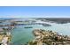 Beautiful aerial view of waterfront homes with private docks on a scenic waterway under a clear blue sky at 425 12Th Ave, Indian Rocks Beach, FL 33785