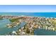 Aerial view highlighting waterfront property's location, beautiful waterway access, and proximity to the ocean at 425 12Th Ave, Indian Rocks Beach, FL 33785