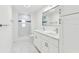 Bright bathroom featuring a dual sink vanity, modern fixtures, and a walk-in shower at 425 12Th Ave, Indian Rocks Beach, FL 33785