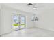 Bright, airy bedroom with a beautiful water view and access to the outdoors at 425 12Th Ave, Indian Rocks Beach, FL 33785
