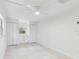 Bedroom boasting bright walls, large windows, built-in storage, and a ceiling fan at 425 12Th Ave, Indian Rocks Beach, FL 33785