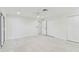 Spacious bedroom featuring white color scheme, modern ceiling fan, and sliding glass door at 425 12Th Ave, Indian Rocks Beach, FL 33785