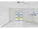 Spacious bedroom with a water view and access to a private outdoor space at 425 12Th Ave, Indian Rocks Beach, FL 33785