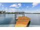 Picturesque waterfront view featuring a wooden dock on a sunny day at 425 12Th Ave, Indian Rocks Beach, FL 33785