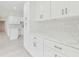 Bright kitchen featuring white cabinets and stylish countertops at 425 12Th Ave, Indian Rocks Beach, FL 33785