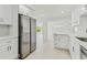 Spacious kitchen with stainless steel appliances and an open concept view into the living area at 425 12Th Ave, Indian Rocks Beach, FL 33785