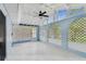 Enclosed sunroom with lattice walls, ceiling fan, tile flooring, and lots of natural light at 425 12Th Ave, Indian Rocks Beach, FL 33785