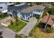 Bird's eye view of a luxurious home with a long driveway, lush landscaping, and a well-manicured lawn at 429 Erie Ave, Tampa, FL 33606