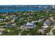 An aerial shot showcases a residential neighborhood near the coast, dotted with lush greenery and various architectural styles at 429 Erie Ave, Tampa, FL 33606