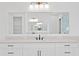 Bathroom vanity featuring a large mirror, and a large white counter at 429 Erie Ave, Tampa, FL 33606