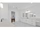 Large bathroom with marble floor, and large counter with dual sinks at 429 Erie Ave, Tampa, FL 33606