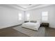 Minimalist bedroom with neutral rug, ample natural light, and tray ceiling at 429 Erie Ave, Tampa, FL 33606
