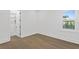 Bright bedroom featuring hardwood floors, closet, and a window that provides plenty of natural light at 429 Erie Ave, Tampa, FL 33606