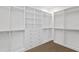 Large walk-in closet with extensive shelving and drawer systems for organization at 429 Erie Ave, Tampa, FL 33606