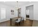 Bright dining room with a modern chandelier, neutral walls, and hardwood floors at 429 Erie Ave, Tampa, FL 33606