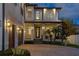 Beautiful home with a front porch, brick driveway, and three-car garage at 429 Erie Ave, Tampa, FL 33606