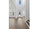 Bright foyer with hardwood floors, high ceilings, a glass front door, and staircase at 429 Erie Ave, Tampa, FL 33606