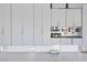 Organized garage featuring storage cabinets, a workbench, and epoxy floors at 429 Erie Ave, Tampa, FL 33606