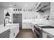 Spacious kitchen with stainless steel refrigerator, white cabinets, and modern appliances at 429 Erie Ave, Tampa, FL 33606
