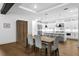 Bright, open kitchen with a white island, stainless steel appliances, and hardwood floors at 429 Erie Ave, Tampa, FL 33606