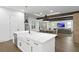 Modern kitchen island featuring white cabinets, stainless steel dishwasher and sink at 429 Erie Ave, Tampa, FL 33606