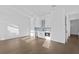 Living room with white cabinetry, stainless steel appliances, and lots of natural light at 429 Erie Ave, Tampa, FL 33606