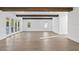 Large living room offers hardwood floors and lots of natural light at 429 Erie Ave, Tampa, FL 33606