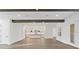 Open concept room flows into a modern white kitchen with an island and pendant lights at 429 Erie Ave, Tampa, FL 33606
