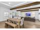 A open concept room with wood beams, and multiple windows for natural light at 429 Erie Ave, Tampa, FL 33606