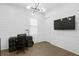 Stylish office with wood paneled walls, modern lighting, and a large window at 429 Erie Ave, Tampa, FL 33606