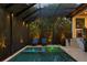 The screened lanai covers a pool and spa area, with outdoor lounge chairs and nearby patio at 429 Erie Ave, Tampa, FL 33606
