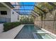 Relaxing screened-in pool area with spa offers a private backyard oasis for outdoor enjoyment at 429 Erie Ave, Tampa, FL 33606