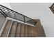 Modern staircase with dark wood steps and minimalist black railings offers a sleek design at 429 Erie Ave, Tampa, FL 33606