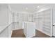 Spacious walk-in closet with custom shelving and drawers, offering ample storage and organization at 429 Erie Ave, Tampa, FL 33606