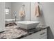 Close-up of a bathroom sink and countertop with tiled backsplash and modern fixtures at 4410 Foxboro Dr, New Port Richey, FL 34653