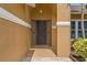 Inviting front entrance with a decorative wreath and neutral colors at 4410 Foxboro Dr, New Port Richey, FL 34653
