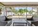 Covered patio with outdoor seating, a grill, and views of the backyard at 4410 Foxboro Dr, New Port Richey, FL 34653