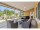 Covered patio with outdoor seating, a grill, and views of the backyard at 4410 Foxboro Dr, New Port Richey, FL 34653