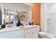 Modern bathroom featuring double sinks, quartz countertops, and a walk-in shower at 4417 Rachel Falls Dr, Tampa, FL 33610