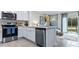 Modern kitchen with stainless appliances and breakfast bar at 4417 Rachel Falls Dr, Tampa, FL 33610