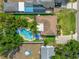 Aerial view of backyard with mature trees providing shade near private swimming pool at 4721 W Lawn Ave, Tampa, FL 33611