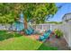 Serene backyard retreat with a cozy seating area and a decorative shed at 4721 W Lawn Ave, Tampa, FL 33611