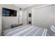Bedroom includes a closet and a view to an ensuite at 4721 W Lawn Ave, Tampa, FL 33611