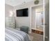 Bright bedroom includes a TV and an ensuite bathroom at 4721 W Lawn Ave, Tampa, FL 33611