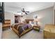 Comfortable main bedroom with ceiling fan and a sliding wood door to the walk-in closet at 4721 W Lawn Ave, Tampa, FL 33611