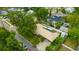 Aerial view of home with mature landscaping and a metal roof at 509 N Walker St, Plant City, FL 33563